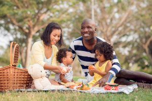 big family picnicking together in the park