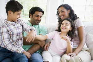 family with kids play fighting