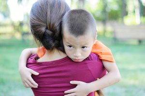 mom carrying child