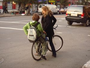 mom + school age child both on bike