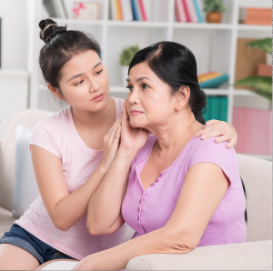 Daughter comforts sad mother during divorce